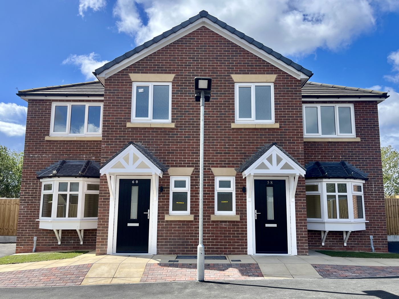 Front elevation of completed semi-detached homes at Sorrel Way, St Helens